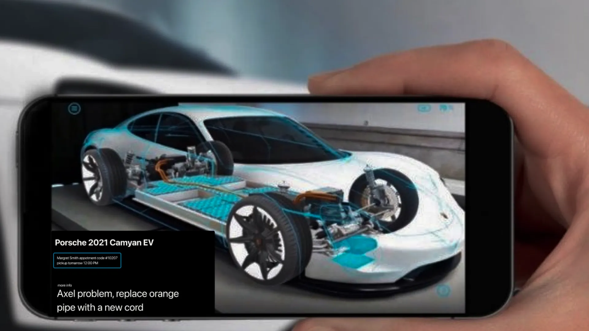 A phone held up to an EV, the AR overlay labelling an orange pipe on a 2021 Porsche Cayenne EV